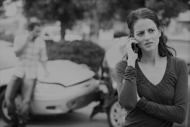 Woman calling the police after a car accident