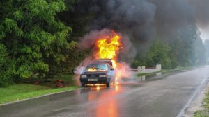 Car after accident engulfed in flames