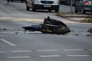 Motorcycle damaged from an accident on a street