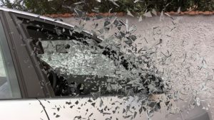 Car's front passenger window shattering upon collision