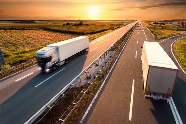 trucks driving on a freeway